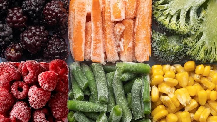 Tray of individually quick frozen berries, carrots, broccoli, green beans and corn